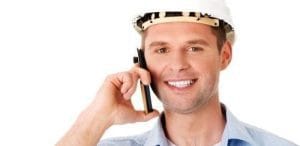 Smiling appliance repair technician taking a phone call to schedule appliance repair in Charlotte